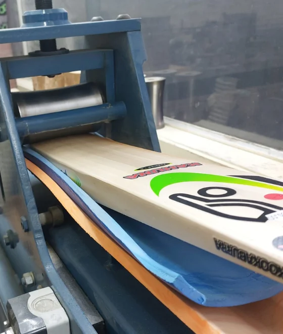A cricket bat in the workshop bat press